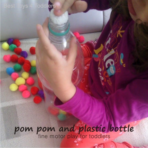 Fine Motor Play Idea for Toddlers - using pom poms and plastic bottle