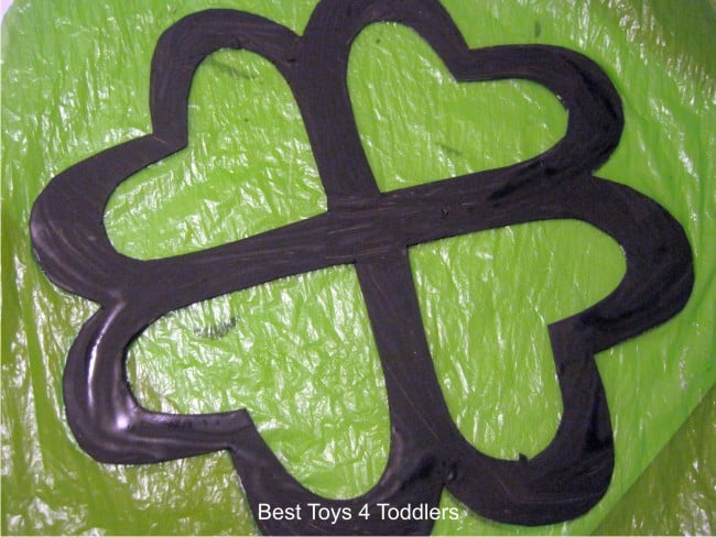 Plastic Bag Shamrock Suncatcher - craft project for kids using items from recycle bin, part of #junkplay challenge
