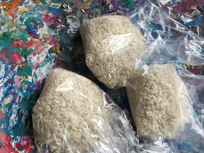 Preparing bean bags filled with rice for gross motor game for kids
